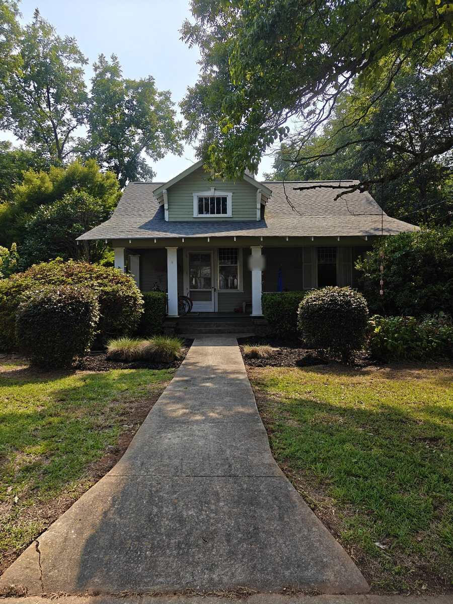 The same Winterville, GA front yard after bed cleanup and fresh black mulch
