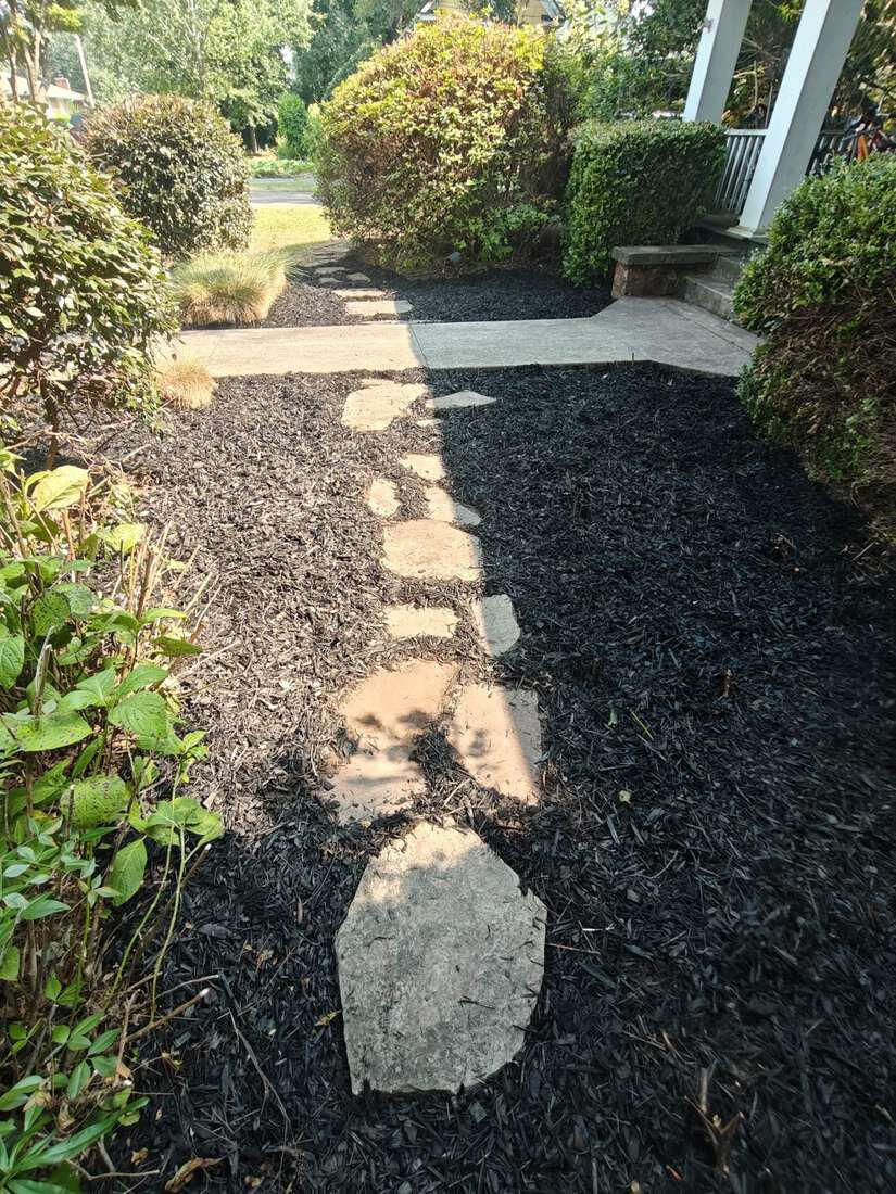 Stepping-stone path through a freshly mulched bed in Winterville, GA